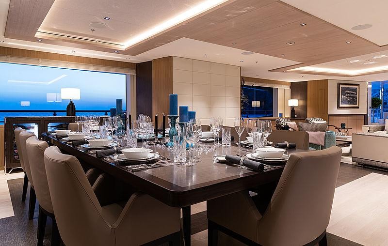 a large room with a table and chairs aboard ARTISAN Yacht for Charter