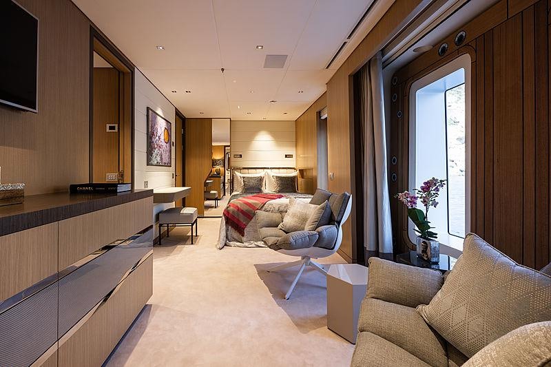 a living room with a couch and a television aboard ARTISAN Yacht for Charter