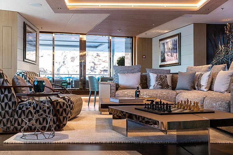 a living room with a large window aboard ARTISAN Yacht for Charter