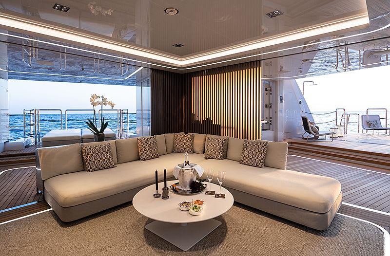 a living room with a large window aboard ARTISAN Yacht for Charter
