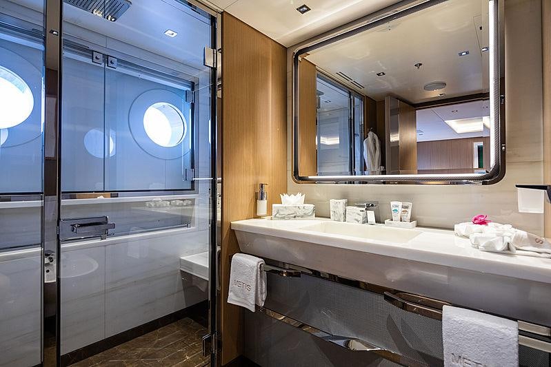 a bathroom with a large mirror aboard ARTISAN Yacht for Charter