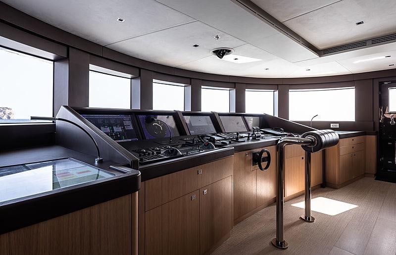a kitchen with a stove and a table aboard ARTISAN Yacht for Charter