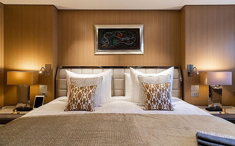 a bed with pillows aboard ARTISAN Yacht for Charter