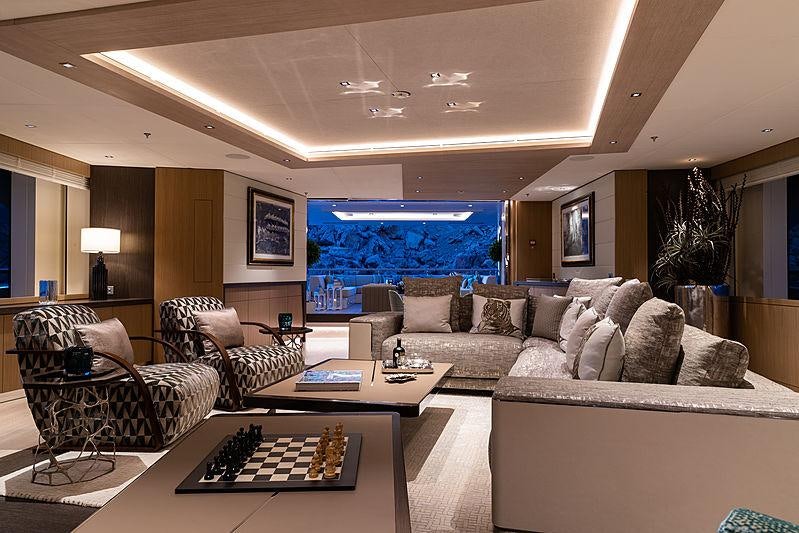 a living room with a large window aboard ARTISAN Yacht for Charter