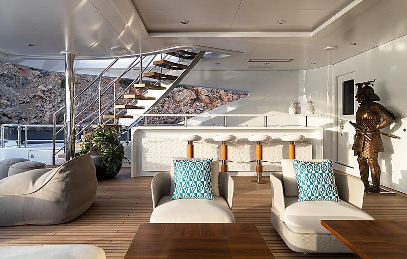 a room with a large staircase and a statue aboard ARTISAN Yacht for Charter