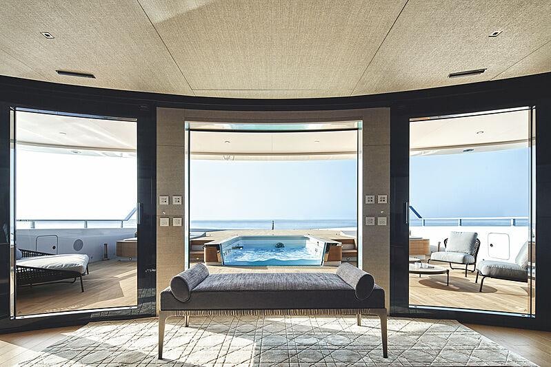 a large room with a couch and a pool table aboard LEMON TREE Yacht for Charter