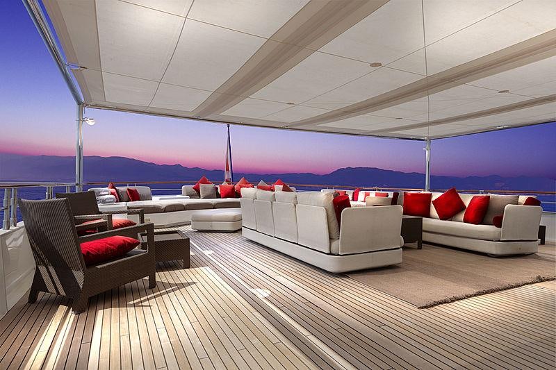 a large room with couches aboard ITOTO Yacht for Charter