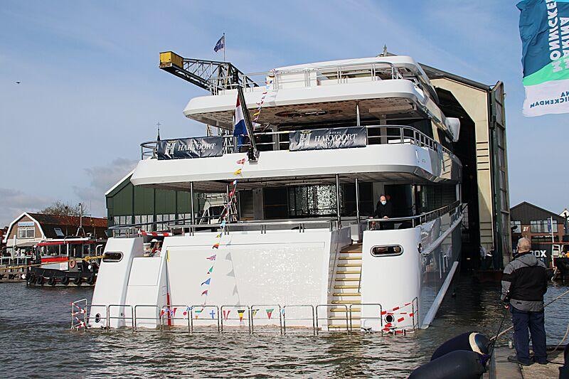 a large white boat docked aboard TOP FIVE II Yacht for Charter
