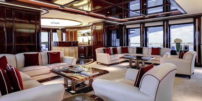 a large room with couches and a table aboard ROCK.IT Yacht for Charter
