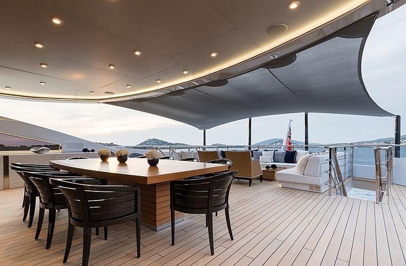 a table and chairs on a deck aboard SAMURAI Yacht for Charter