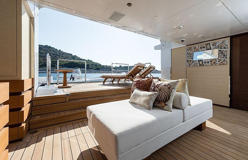 a living room with a large window aboard SAMURAI Yacht for Charter