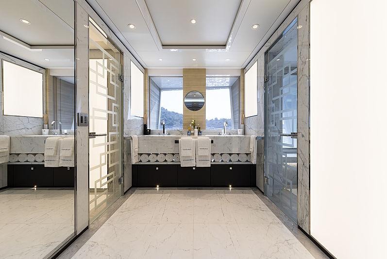 a large bathroom with glass doors aboard SAMURAI Yacht for Charter