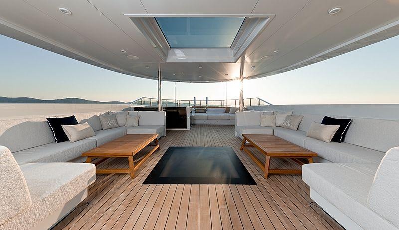 a large living room with a large open ceiling aboard SAMURAI Yacht for Charter