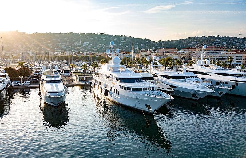 a group of boats are parked in a harbor aboard BELLA VITA Yacht for Charter