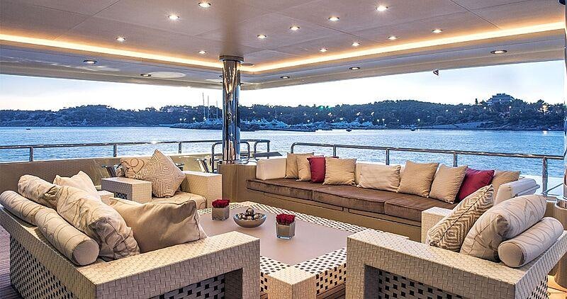 a living room with a couch and a table aboard LIGHT HOLIC Yacht for Charter