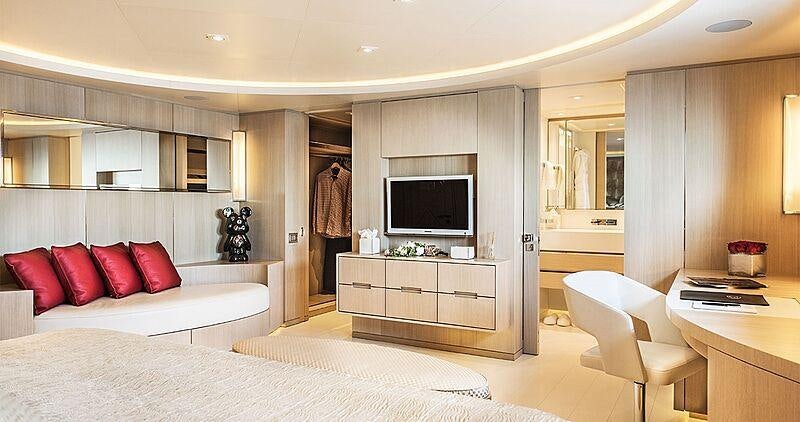 a room with a bed and a tv aboard LIGHT HOLIC Yacht for Charter