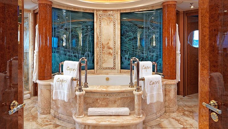 a bathroom with a bathtub and toilet aboard CAPRI I Yacht for Charter