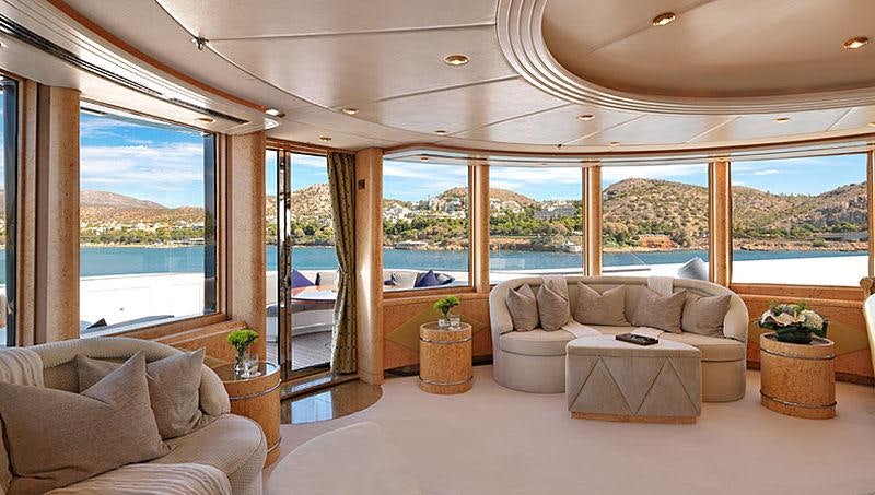 a living room with a large window aboard CAPRI I Yacht for Charter