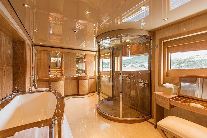 a bathroom with a glass shower aboard FRIENDSHIP Yacht for Charter