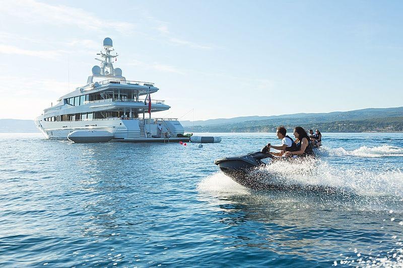 a group of people riding a boat in the water aboard FRIENDSHIP Yacht for Charter