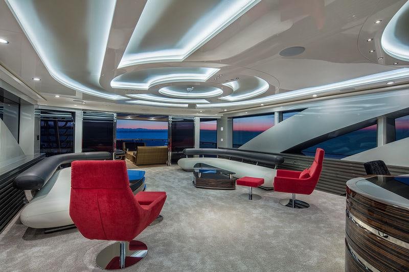 a room with a pool table and chairs aboard EUPHORIA II Yacht for Charter