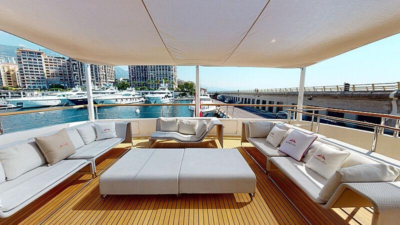 a room with a bed and a large city in the background aboard LA PELLEGRINA 1 Yacht for Charter