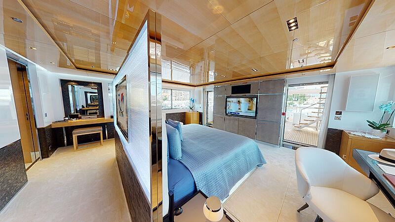 a room with a bed and a tv aboard LA PELLEGRINA 1 Yacht for Charter