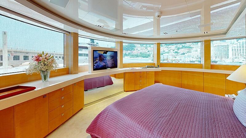 a room with a bed and a tv on the wall aboard LA PELLEGRINA 1 Yacht for Charter
