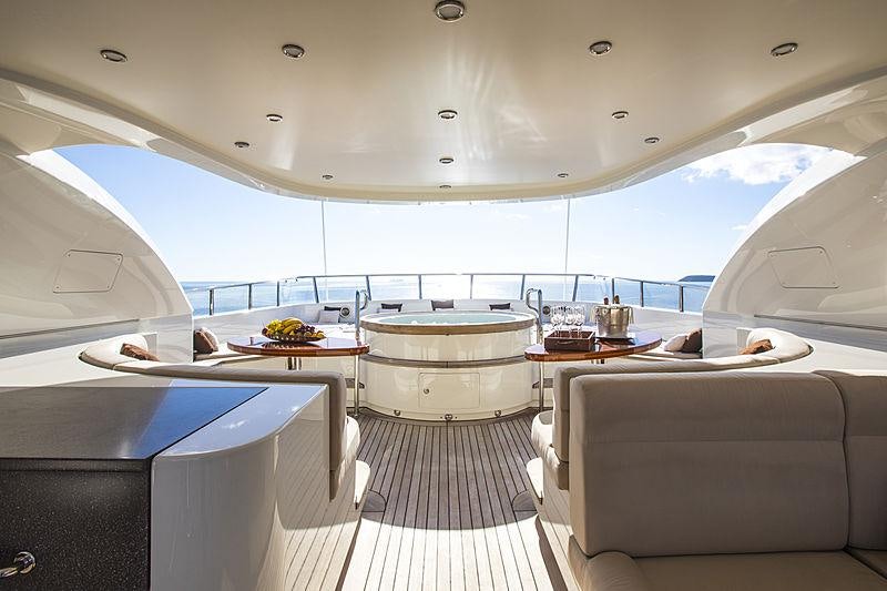 a room with a table and chairs aboard MAXIMILIAN MMIV Yacht for Charter