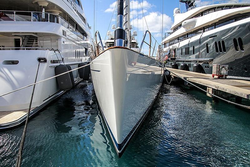 several boats docked at a pier aboard MES AMIS Yacht for Charter