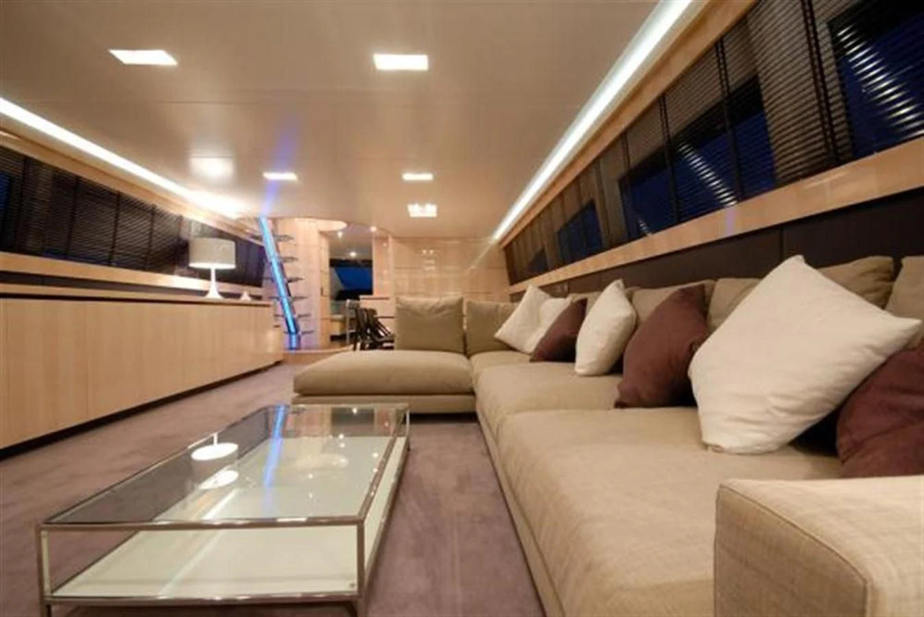 a living room with a glass table aboard SANS SOUCI Yacht for Sale