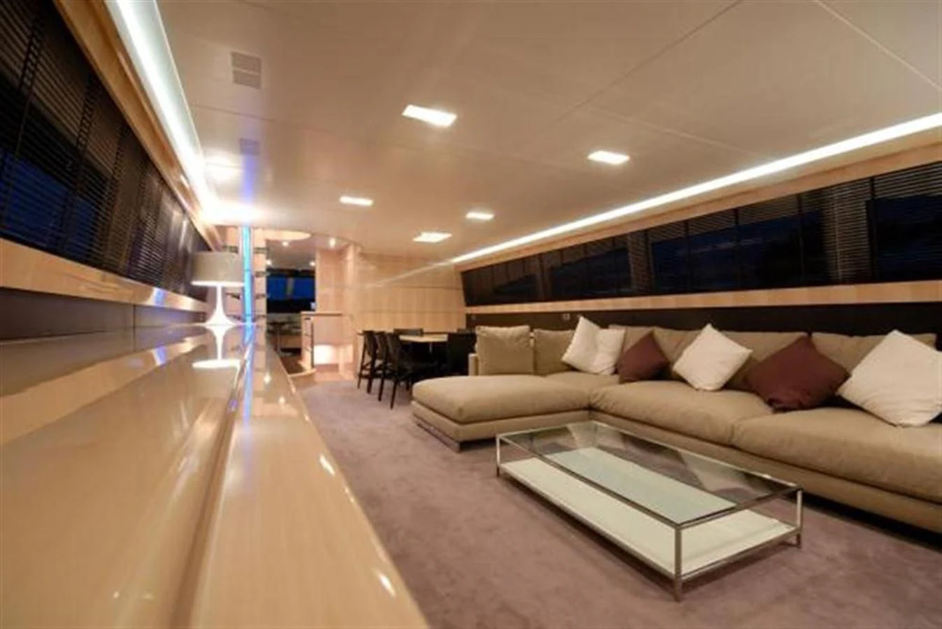 a living room with a couch and a table aboard SANS SOUCI Yacht for Sale