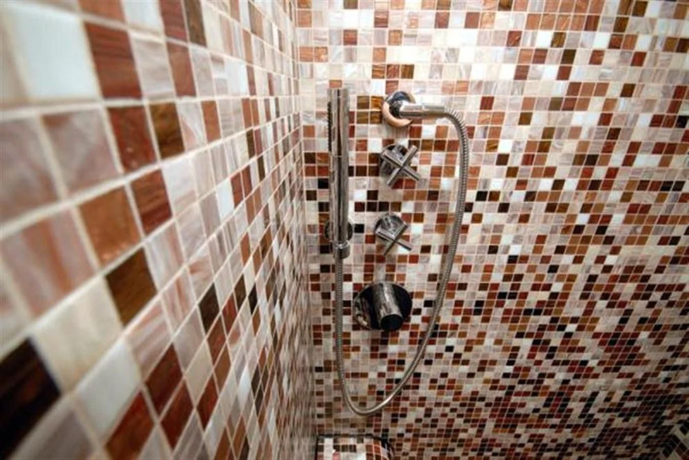 a shower with a tile wall aboard SANS SOUCI Yacht for Sale