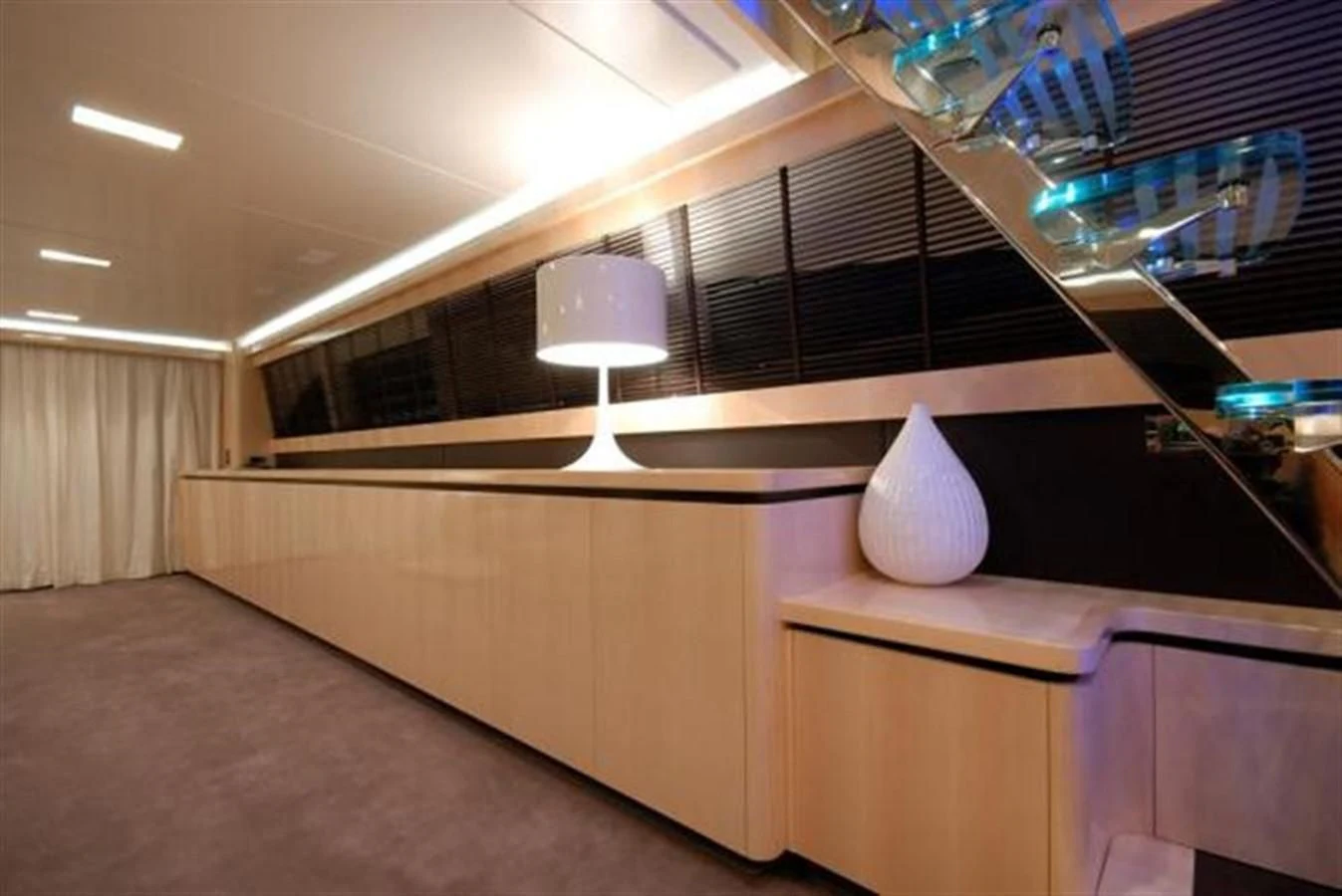 a room with a lamp and a white object on the ceiling aboard SANS SOUCI Yacht for Sale