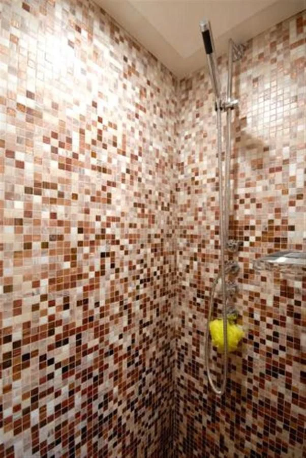 a shower with a shower curtain aboard SANS SOUCI Yacht for Sale