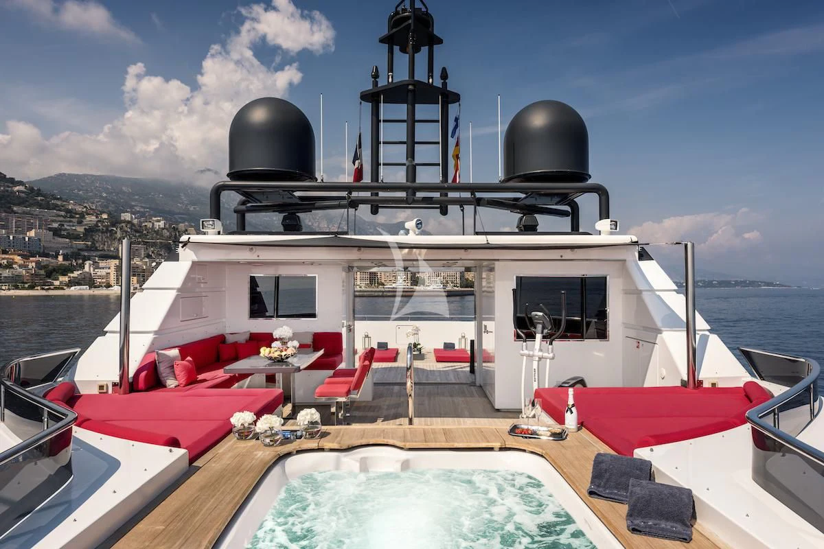 a boat with a grill on the deck aboard THANUJA Yacht for Sale