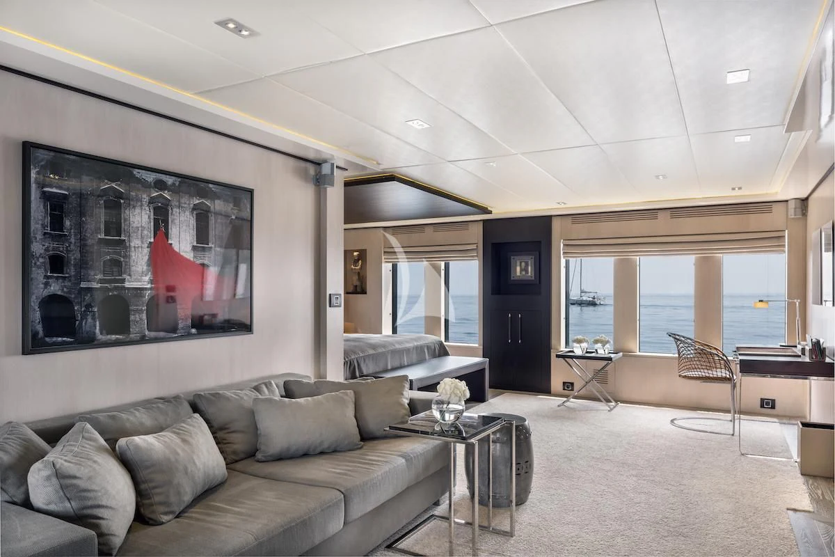 a living room with a large screen aboard THANUJA Yacht for Sale