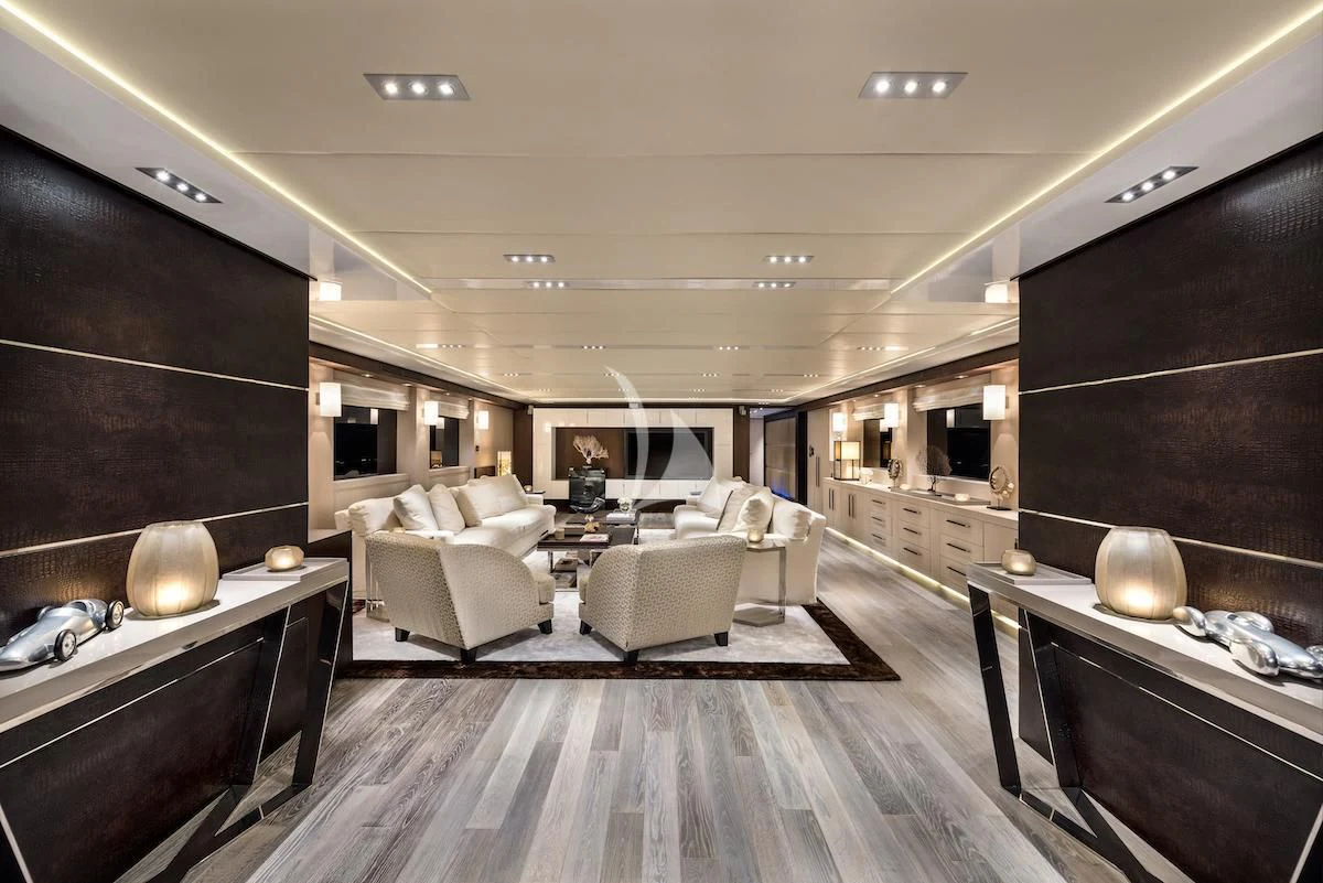 a room with a table chairs and a couch aboard THANUJA Yacht for Sale