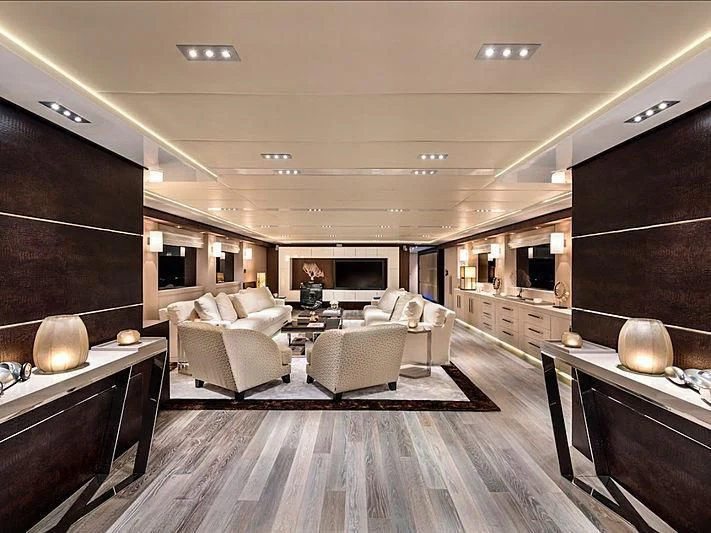 a living room with a wood floor aboard THANUJA Yacht for Sale