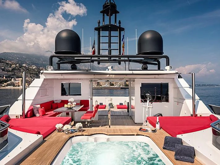 a boat with a large black dome on it aboard THANUJA Yacht for Sale