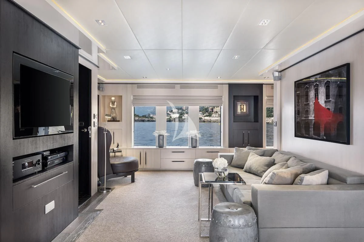 a living room with a couch and a tv aboard THANUJA Yacht for Sale