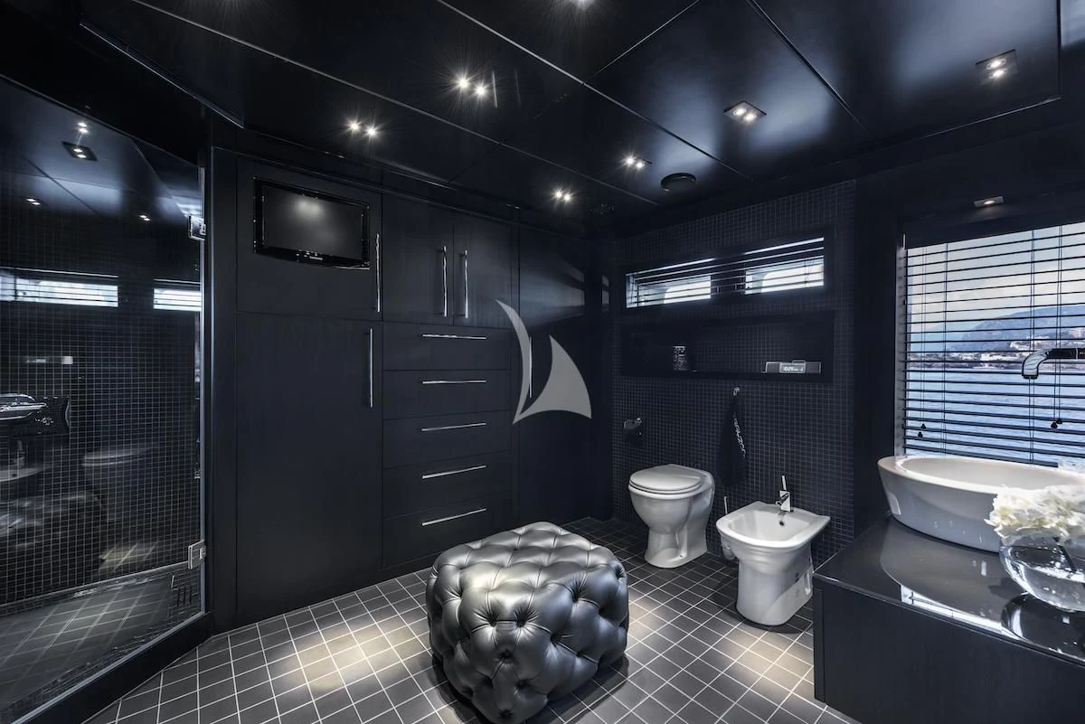 a bathroom with a marble floor aboard THANUJA Yacht for Sale