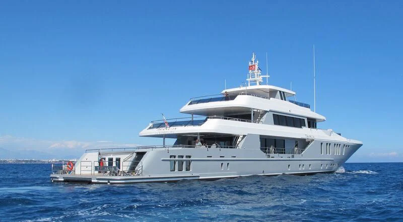 a large white boat in the water aboard THANUJA Yacht for Sale