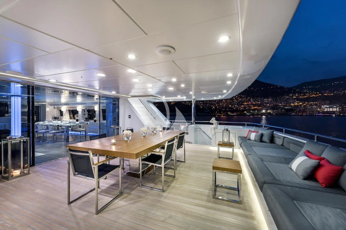 a room with a table and chairs aboard THANUJA Yacht for Sale