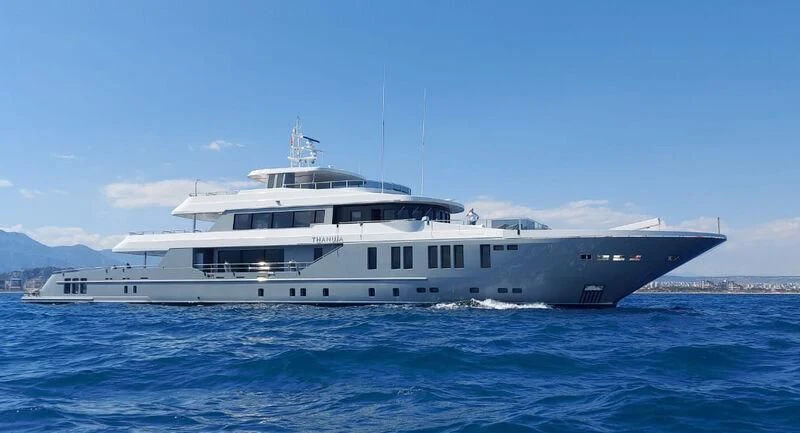a large white boat in the water aboard THANUJA Yacht for Sale