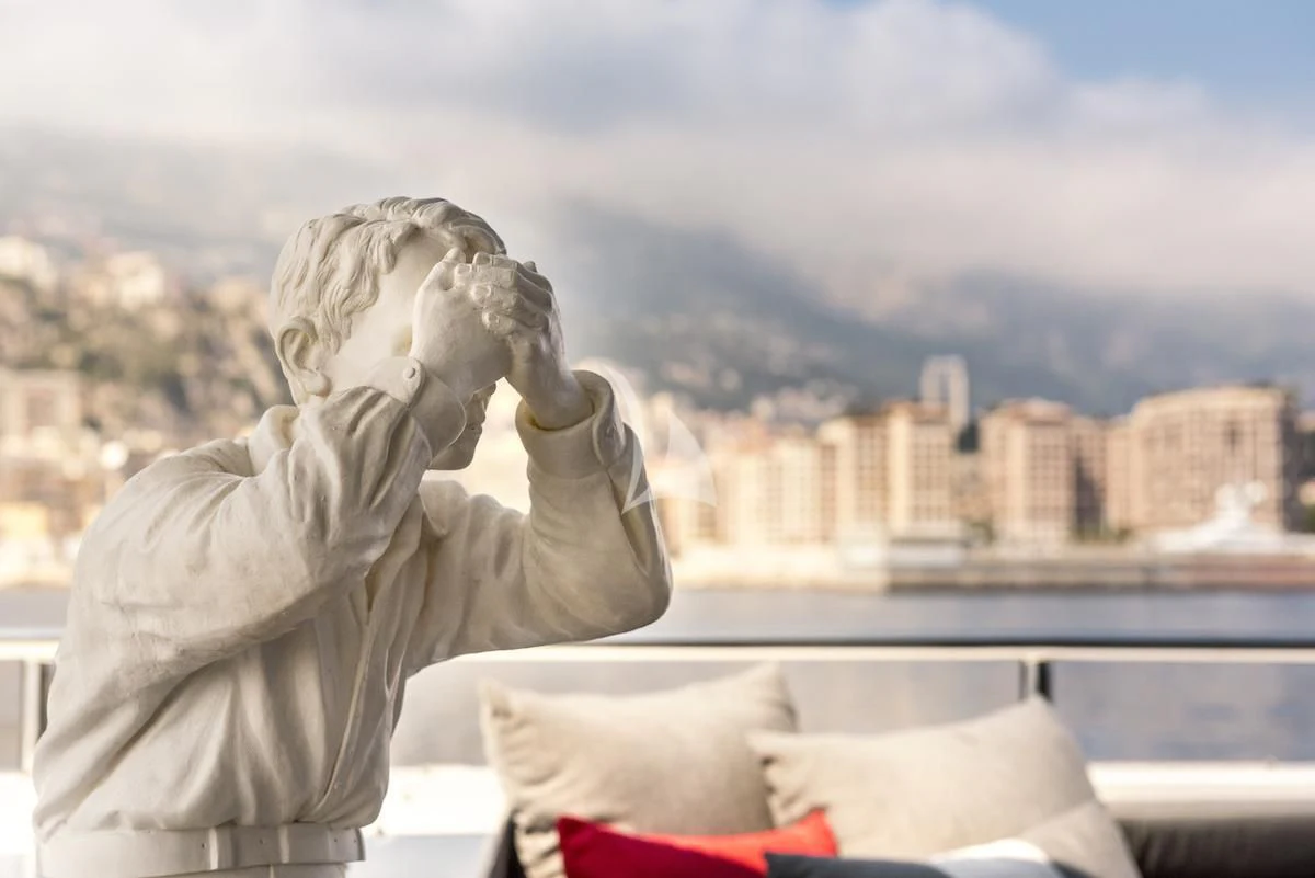 a person covering their face with their hands aboard THANUJA Yacht for Sale