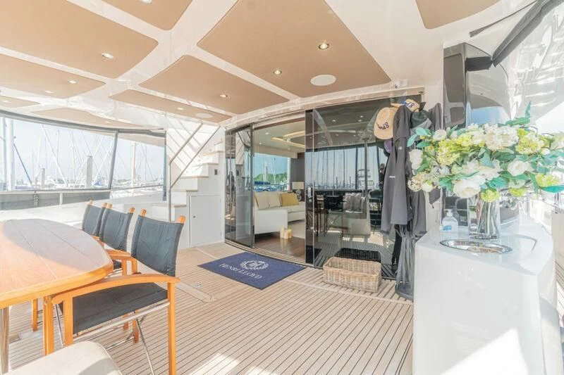 a room with tables and chairs aboard LADY O Yacht for Sale