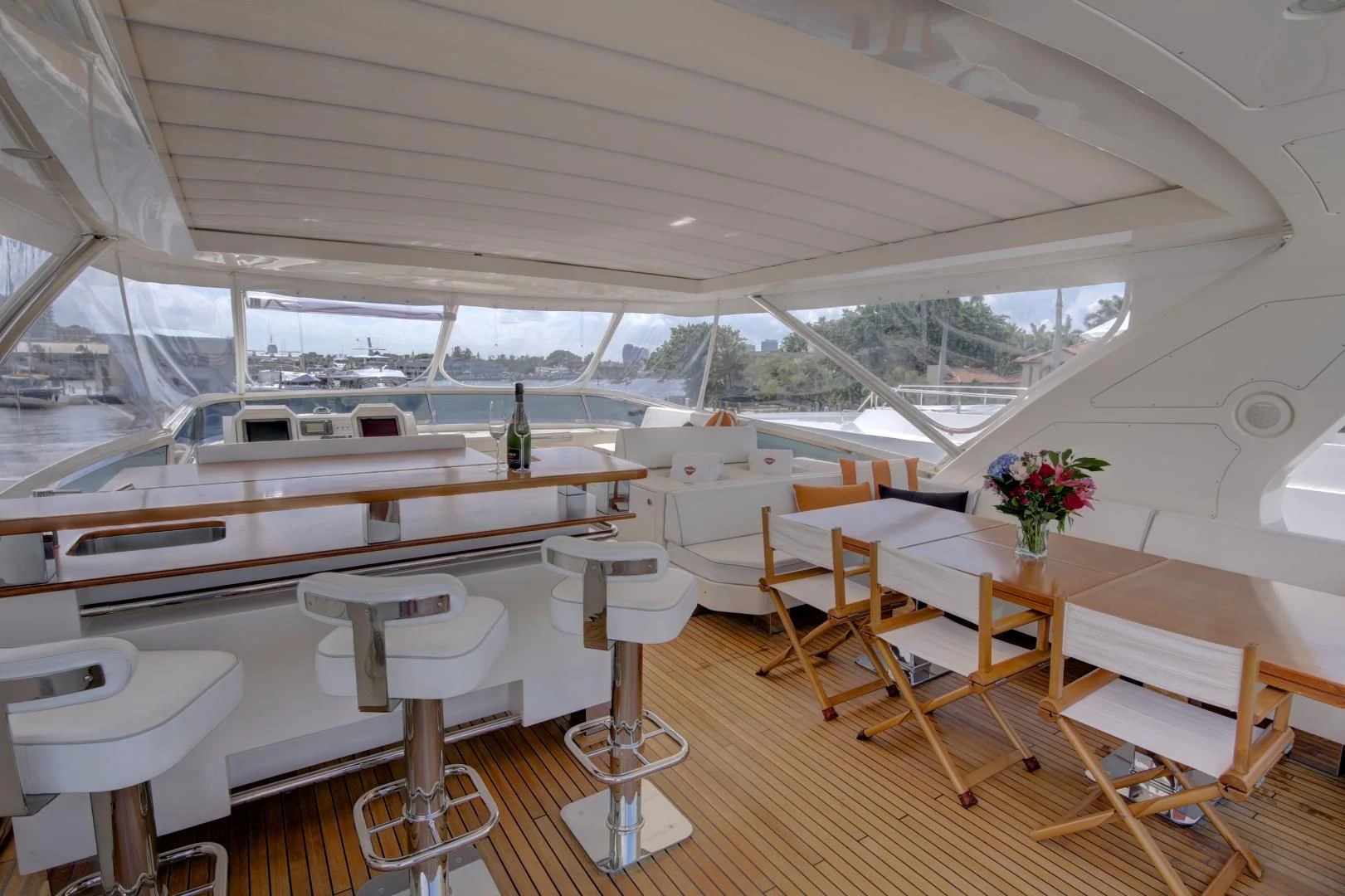 a room with tables and chairs aboard SORRIDENTE Yacht for Sale