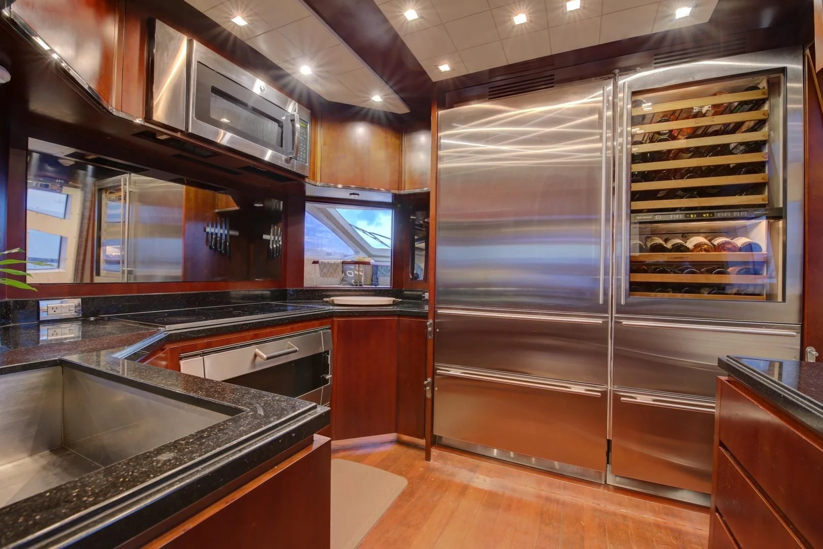 a kitchen with a large glass wall aboard SORRIDENTE Yacht for Sale