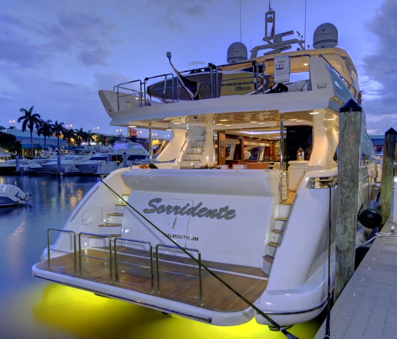 a boat docked at a pier aboard SORRIDENTE Yacht for Sale